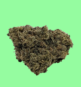 Close-up of cannabis bud on a green background