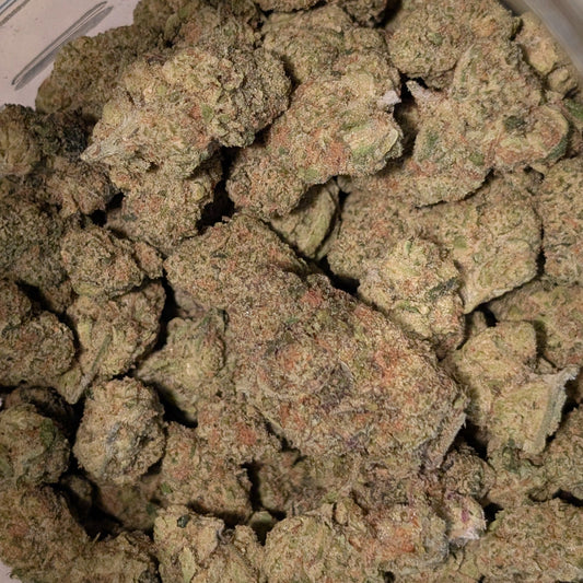 Close-up of cannabis buds in a metal container